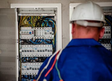electrician working at fusebox
